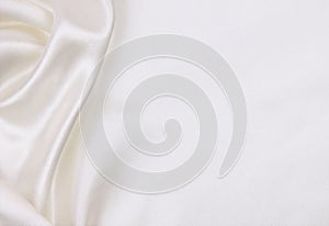 Smooth elegant white silk or satin luxury cloth texture as wedding background. Luxurious background design