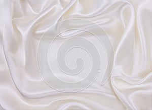 Smooth elegant white silk or satin luxury cloth texture as wedding background. Luxurious background design