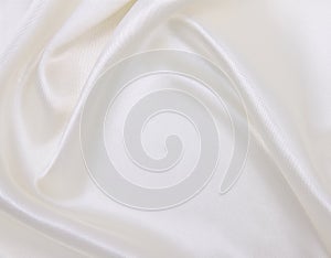 Smooth elegant white silk or satin luxury cloth texture as wedding background. Luxurious background design