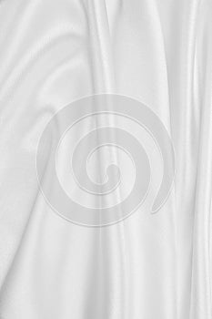 Smooth elegant white silk or satin luxury cloth texture as wedding background. Luxurious background design