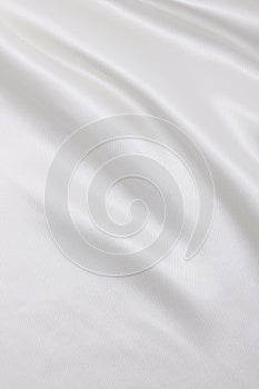 Smooth elegant white silk or satin luxury cloth texture as wedding background. Luxurious background design