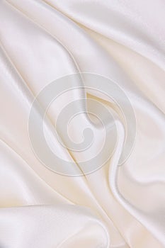 Smooth elegant white silk or satin luxury cloth texture as wedding background. Luxurious background design