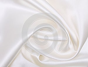 Smooth elegant white silk or satin luxury cloth texture as wedding background. Luxurious background design