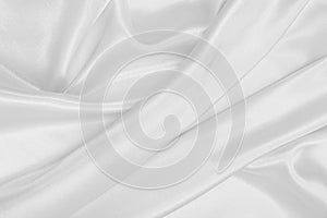 Smooth elegant white silk or satin luxury cloth texture as wedding background. Luxurious background design