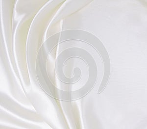 Smooth elegant white silk or satin luxury cloth texture as wedding background. Luxurious background design