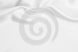 Smooth elegant white silk or satin luxury cloth texture as wedding background. Luxurious background design