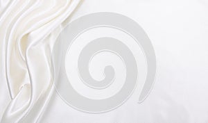 Smooth elegant white silk or satin luxury cloth texture as wedding background. Luxurious background design