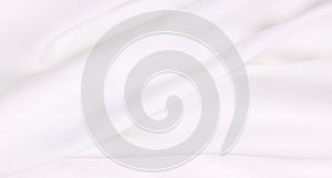 Smooth elegant white silk or satin luxury cloth texture as wedding background. Luxurious background design