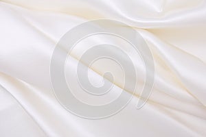 Smooth elegant white silk or satin luxury cloth texture as wedding background. Luxurious background design