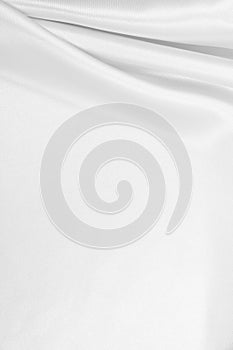 Smooth elegant white silk or satin luxury cloth texture as wedding background. Luxurious background design