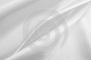 Smooth elegant white silk or satin luxury cloth texture as wedding background. Luxurious background design