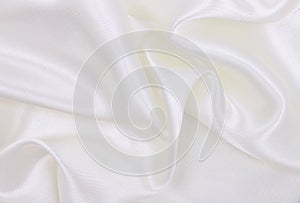 Smooth elegant white silk or satin luxury cloth texture as wedding background. Luxurious background design