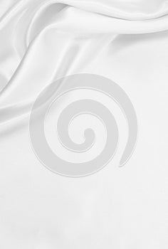 Smooth elegant white silk or satin luxury cloth texture as wedding background. Luxurious background design