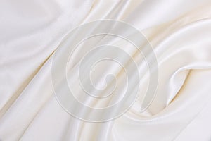 Smooth elegant white silk or satin luxury cloth texture as wedding background. Luxurious background design