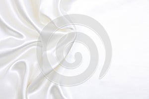 Smooth elegant white silk or satin luxury cloth texture as wedding background. Luxurious background design