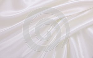 Smooth elegant white silk or satin luxury cloth texture as wedding background. Luxurious background design