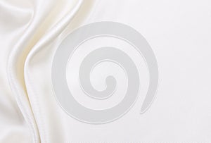 Smooth elegant white silk or satin luxury cloth texture as wedding background. Luxurious background design