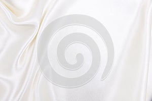 Smooth elegant white silk or satin luxury cloth texture as wedding background. Luxurious background design