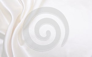 Smooth elegant white silk or satin luxury cloth texture as wedding background. Luxurious background design