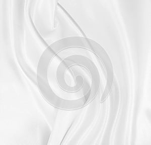 Smooth elegant white silk or satin luxury cloth texture as wedding background. Luxurious background design