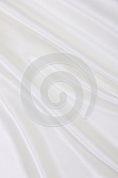 Smooth elegant white silk or satin luxury cloth texture as wedding background. Luxurious background design