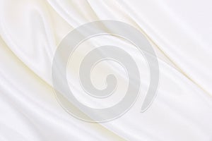 Smooth elegant white silk or satin luxury cloth texture as wedding background. Luxurious background design