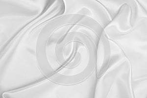 Smooth elegant white silk or satin luxury cloth texture as wedding background. Luxurious background design