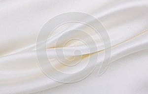 Smooth elegant white silk or satin luxury cloth texture as wedding background. Luxurious background design