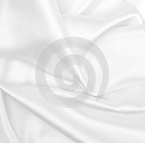 Smooth elegant white silk or satin luxury cloth texture as wedding background. Luxurious background design