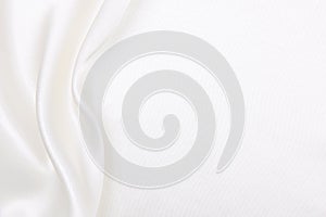 Smooth elegant white silk or satin luxury cloth texture as wedding background. Luxurious background design