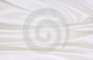 Smooth elegant white silk or satin luxury cloth texture as wedding background. Luxurious background design