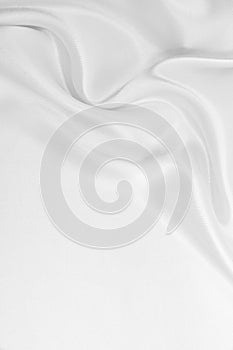 Smooth elegant white silk or satin luxury cloth texture as wedding background. Luxurious background design