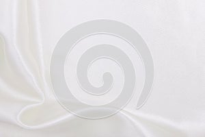 Smooth elegant white silk or satin luxury cloth texture as wedding background. Luxurious background design