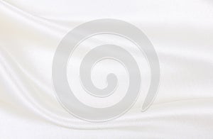 Smooth elegant white silk or satin luxury cloth texture as wedding background. Luxurious background design