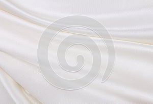 Smooth elegant white silk or satin luxury cloth texture as wedding background. Luxurious background design