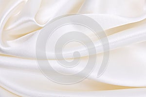 Smooth elegant white silk or satin luxury cloth texture as wedding background. Luxurious background design