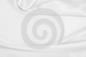 Smooth elegant white silk or satin luxury cloth texture as wedding background. Luxurious background design