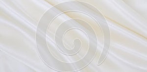 Smooth elegant white silk or satin luxury cloth texture as wedding background. Luxurious background design