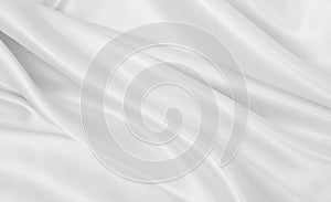 Smooth elegant white silk or satin luxury cloth texture as wedding background. Luxurious background design