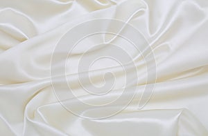 Smooth elegant white silk or satin luxury cloth texture as wedding background. Luxurious background design