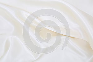 Smooth elegant white silk or satin luxury cloth texture as wedding background. Luxurious background design