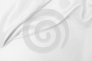 Smooth elegant white silk or satin luxury cloth texture as wedding background. Luxurious background design