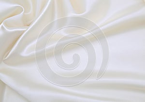 Smooth elegant white silk or satin luxury cloth texture as wedding background. Luxurious background design