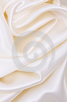 Smooth elegant white silk or satin luxury cloth texture as wedding background. Luxurious background design