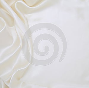 Smooth elegant white silk or satin luxury cloth texture as wedding background. Luxurious background design