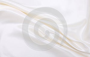 Smooth elegant white silk or satin luxury cloth texture  as wedding background. Luxurious background design