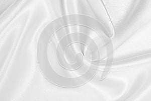 Smooth elegant white silk or satin luxury cloth texture as wedding background. Luxurious background design