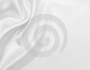 Smooth elegant white silk or satin luxury cloth texture as wedding background. Luxurious Christmas background or New Year