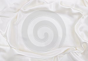 Smooth elegant white silk or satin luxury cloth texture as wedding background. Luxurious Christmas background or New Year