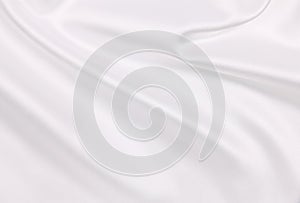 Smooth elegant white silk or satin luxury cloth texture as wedding background. Luxurious Christmas background or New Year